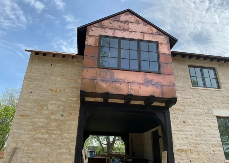 Copper metal panel facade on a stone building for Metal Roof Coating in Berea